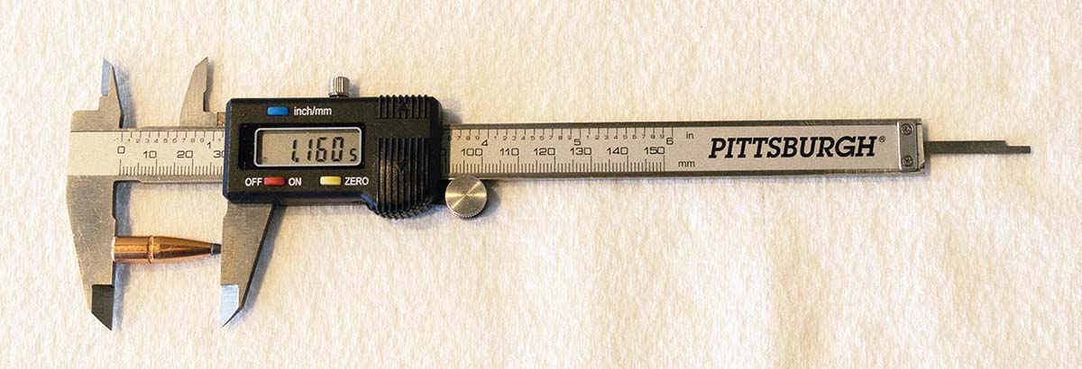 Measurement setup for bullet overall length (BOL).